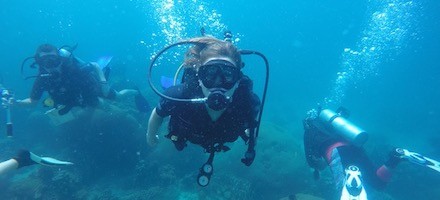 three scuba divers