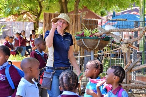 Woman who attended Loop Abroad program at South Africa visit a children school.