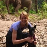 Dr. Erica Ward holding a rescued dog