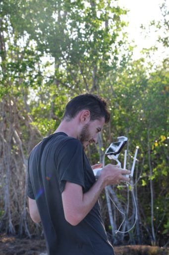 Man holding on the drone controller