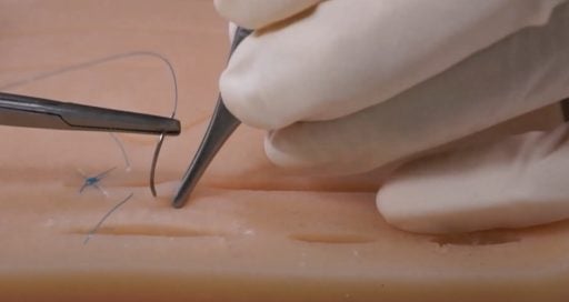 Close-up of suture technique practice