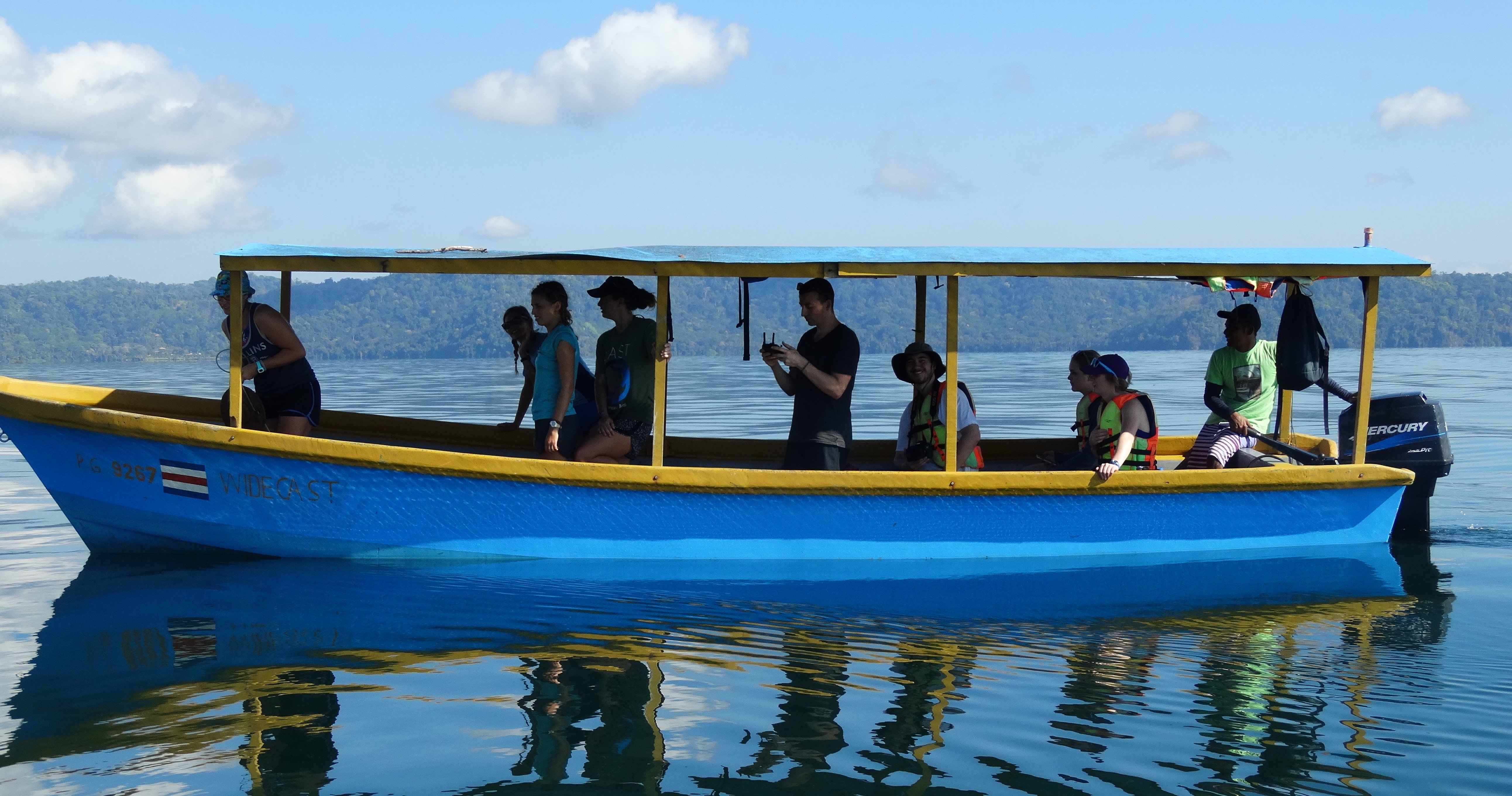 Students inside a blue boat
