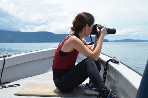 Vet student taking pictures in the vast sea